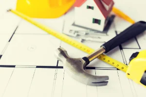 Stock image of hammer and measuring tape