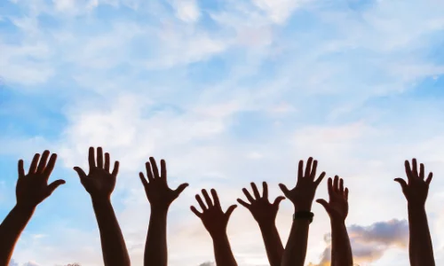 Hands raised in the air