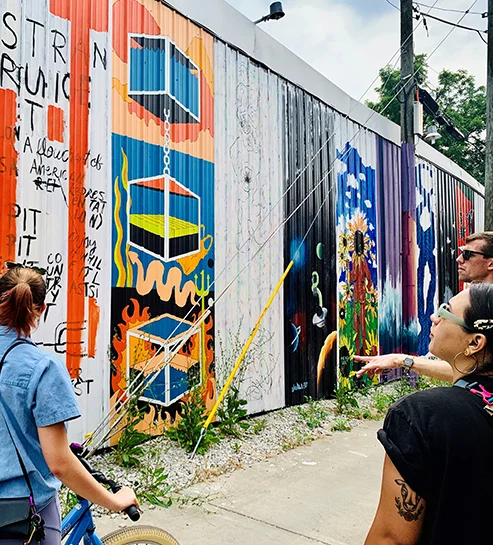 People looking at mural
