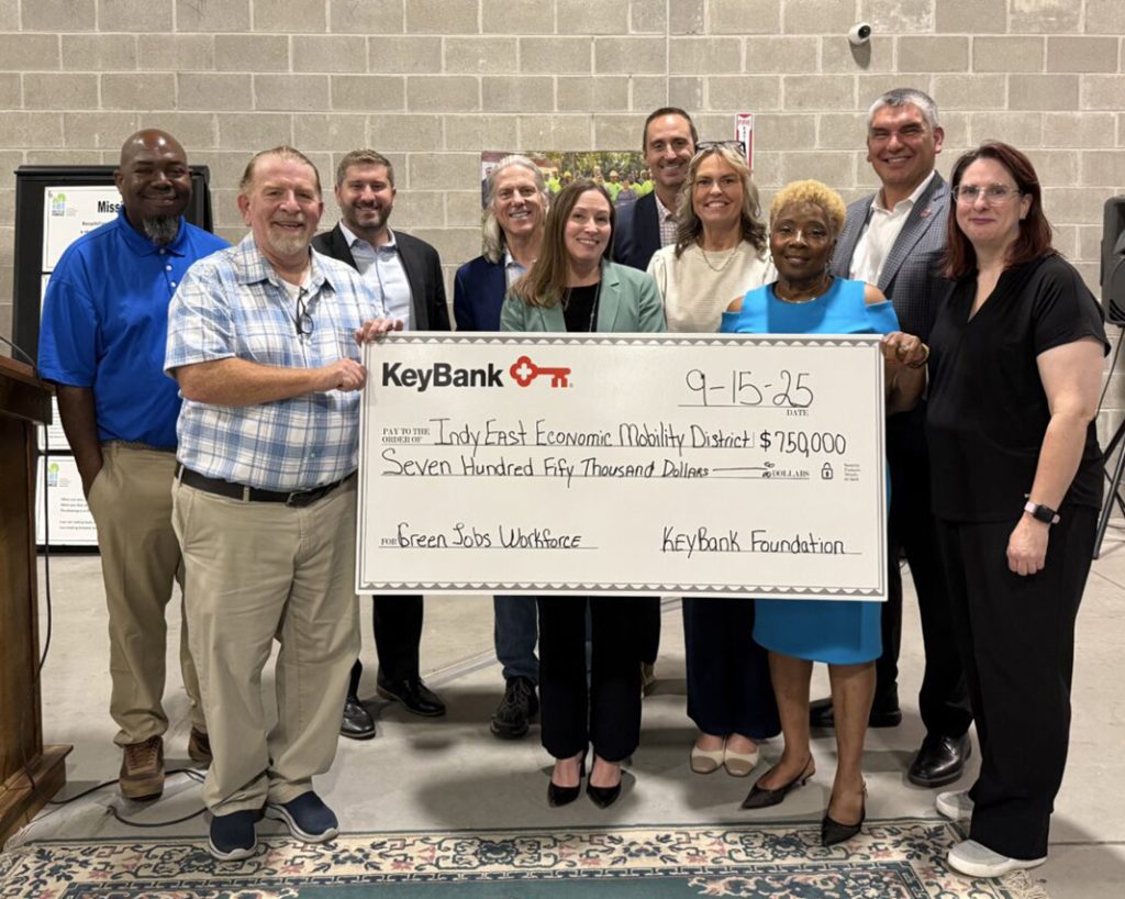 People holding giant check