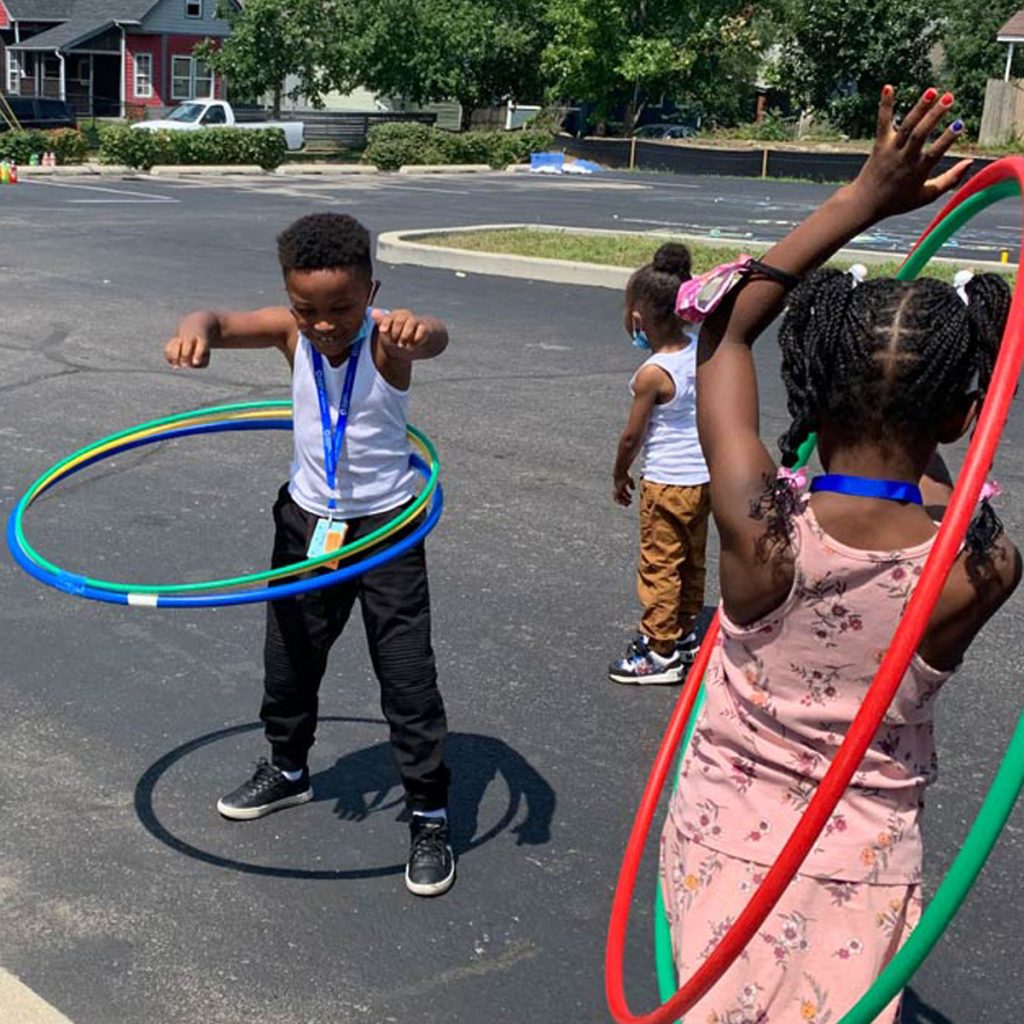 Children hula-hooping