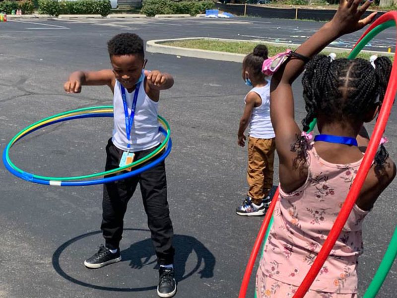 Children hula-hooping